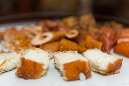 a plate of food with cheese and mushrooms on it at Hotel Wilhelmshöhe in Warnemünde