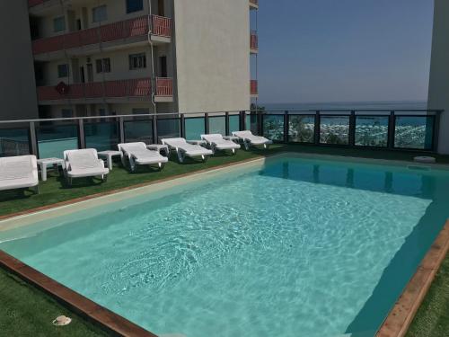 a swimming pool on the roof of a building at Hotel Mirage in Lido di Classe