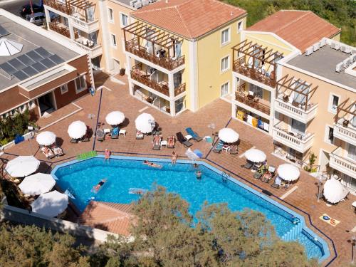 an aerial view of a pool at a hotel at Porto Kalamaki Hotel in Kalamaki Chanion