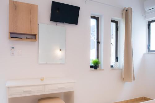 Televízia a/alebo spoločenská miestnosť v ubytovaní Stellar Apartments I