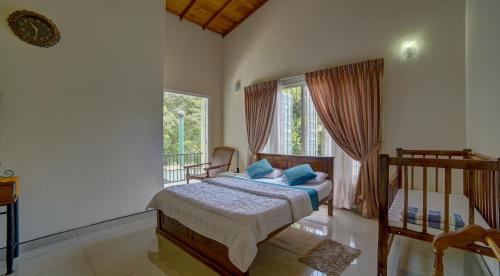 a bedroom with a bed and a balcony at Hanthana Holiday Rooms in Kandy