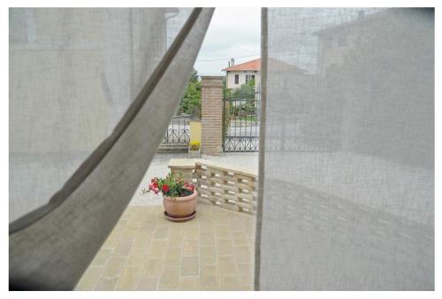 a view of a balcony with a pot of flowers at Agriturismo Monte Cologna in Foligno