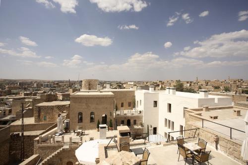 a view of a city from the roof of a building at Kasr-i Nehroz Hotel in Midyat