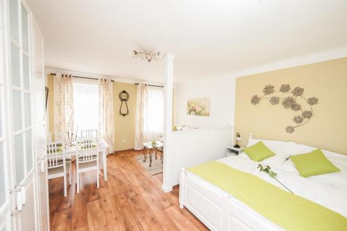 a bedroom with a large bed and a dining room at Traditional Apartments Vienna TAV - Entire in Vienna