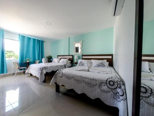 מיטה או מיטות בחדר ב-Apartahotel Bahia Tropical III