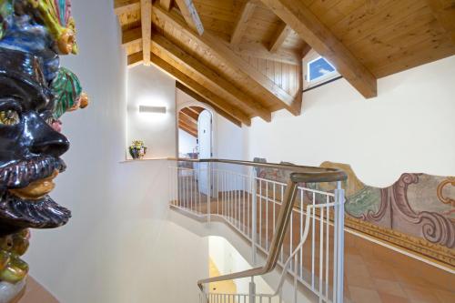 a staircase in a house with a statue at Il Moro Di Positano in Positano