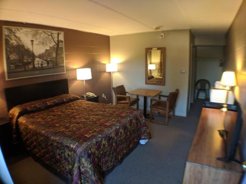 En eller flere senger på et rom på Attican Motel - Attica - Batavia - Warsaw - Darien Lake