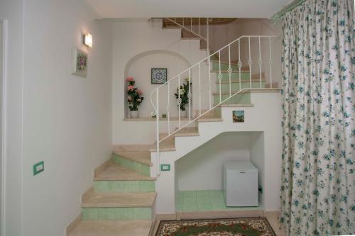 a staircase in a home with a shower curtain at Casa Pamela in Capri