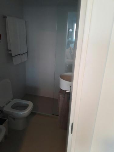 a bathroom with a toilet and a sink at Edificio "Bahia" Punta Ballena. in Punta del Este