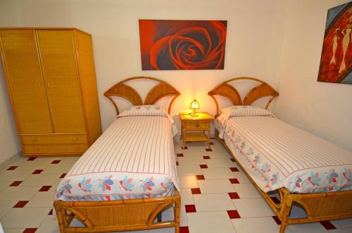 Ένα ή περισσότερα κρεβάτια σε δωμάτιο στο Casa Tramonto - RosariaVacanze