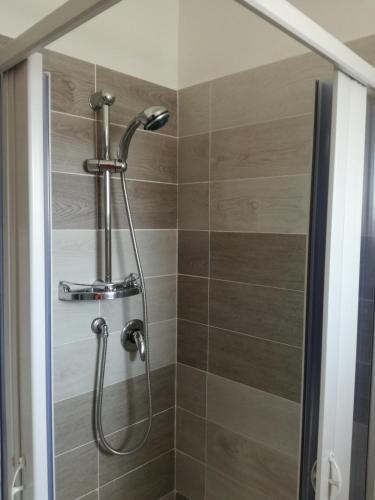 a shower with a shower head in a bathroom at B&B Pozzo Innamorato in Montenero di Bisaccia