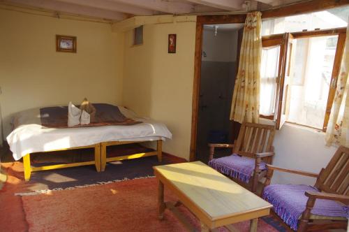 Postel nebo postele na pokoji v ubytování Orchard Huts