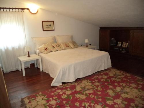 Ένα ή περισσότερα κρεβάτια σε δωμάτιο στο Villa Aunti