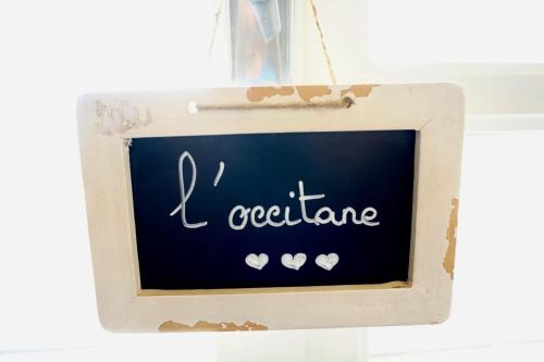a chalkboard sign with the words i octane at La Bergerie De Valerie in Arthès