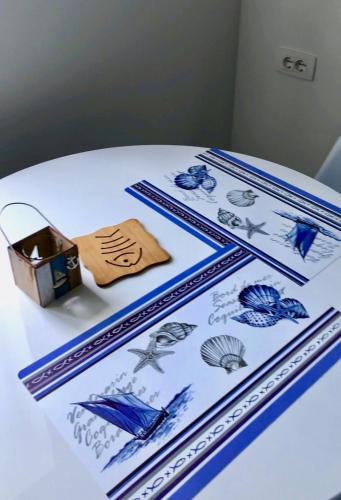 a white table with a cake with blue decorations on it at Luxury Villa Minerva Gardens in Split