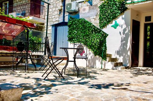a table and chairs sitting outside of a building at Luxury Villa Minerva Gardens in Split