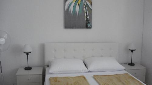 Posteľ alebo postele v izbe v ubytovaní Nevena Apartments