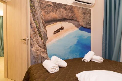 a bedroom with a mural of a cave at Laura Beach House in Alykes