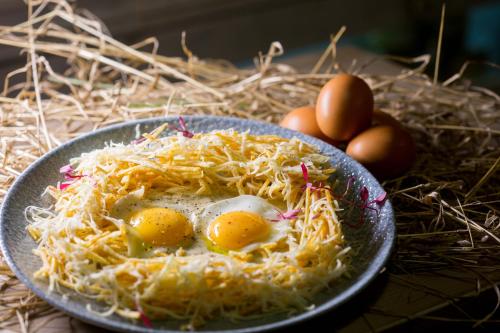 a plate of eggs on a table with some eggs at Athina Studios and Suites Plaka in Plaka