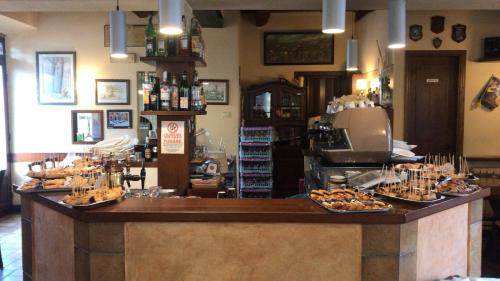 a food counter in a store with plates of food at Affittacamere La Loggia in Altopascio