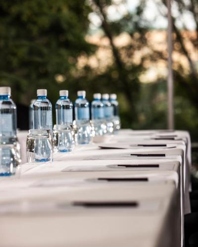 a group of bottles of water on a table at Avani Maseru Hotel in Maseru