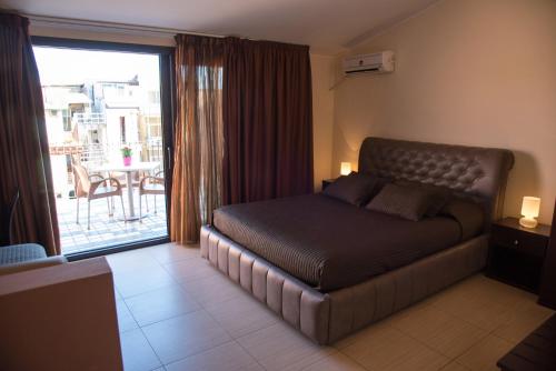 Postel nebo postele na pokoji v ubytování Acitrezza B&B