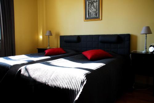 
Säng eller sängar i ett rum på Hotell Laurentius
