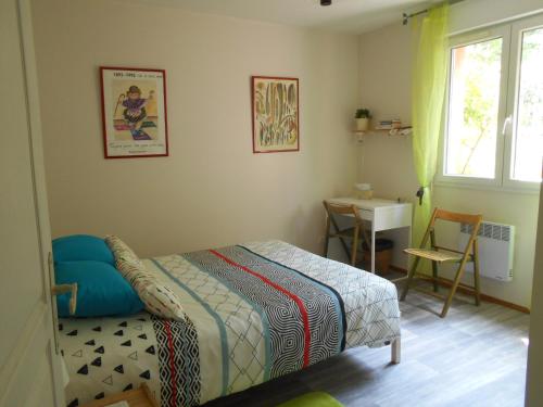 Postel nebo postele na pokoji v ubytování chez Isabelle