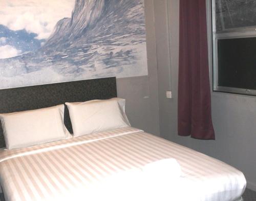 A bed or beds in a room at Jabez Resort Kundasang