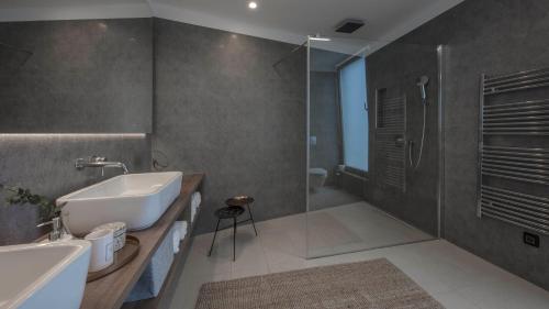 a bathroom with a sink and a shower at Villa Ana in Splitska