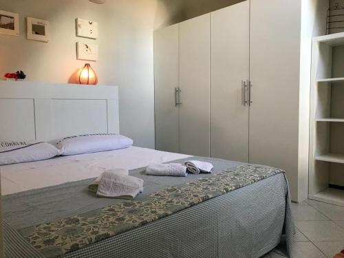 a bedroom with a bed with two towels on it at Casa Pignolo in Bergamo