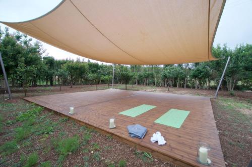 a large tent with a basketball court in a field at Magnolia Apartments in Fiskardho