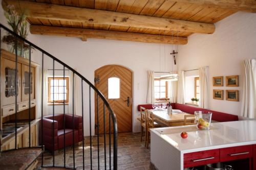 a living room with a kitchen and a dining room at Ferienhaus Troadkasten - Familie Friedrich in Hartberg