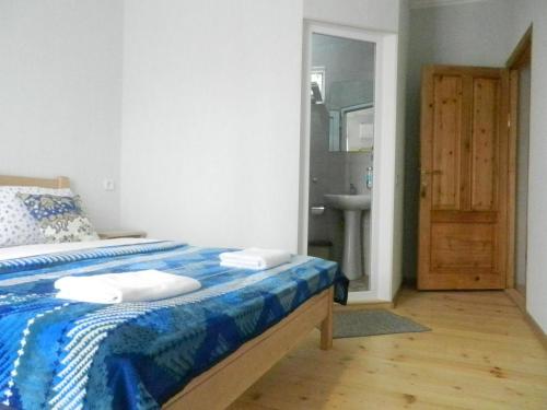 Postel nebo postele na pokoji v ubytování guest house katia tbilisi