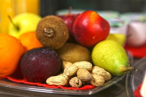 a bowl of fruit and nuts on a table at Albergo Gusmeroli in Tirano
