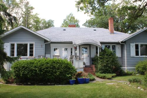 a home with a gray house at Aaron's on the Lake in Matlock