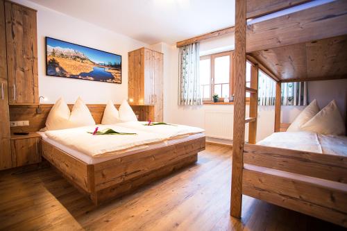 a bedroom with two bunk beds in a room at Grafenberg Chalet in Wagrain