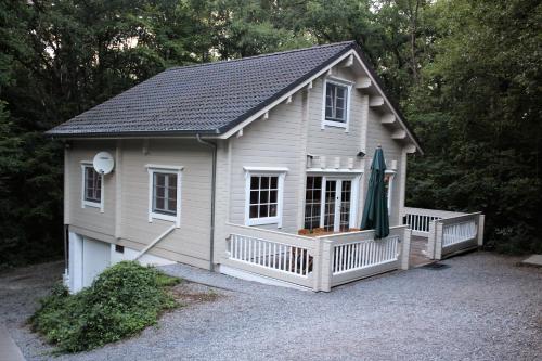 a small shed with a porch and a roof at Chalet Alppimaja in Vesin