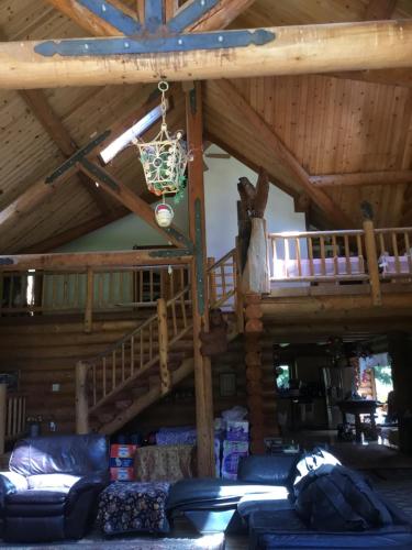 a living room with couches and a loft at Redwood forest in Crescent City