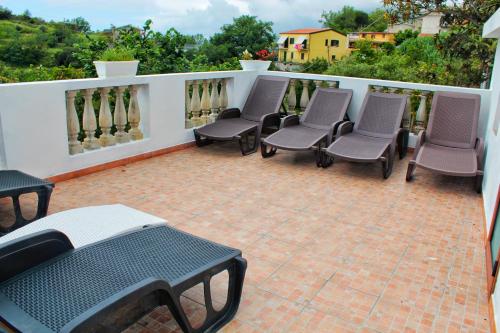 a group of chairs sitting on a patio at B&B Verzavò in Cetraro