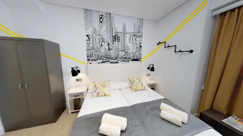 Hostal Boutique La Española by Bossh Hotels tesisinde bir odada yatak veya yataklar