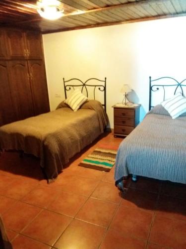 Ένα ή περισσότερα κρεβάτια σε δωμάτιο στο Casas Los Abuelos De Calderon