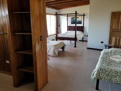 a room with two beds and a room with two beds at Hotel Monte Campana Escazu in San José