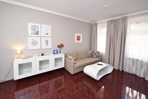a living room with a couch and a table at Apartments-Leipzig in Leipzig