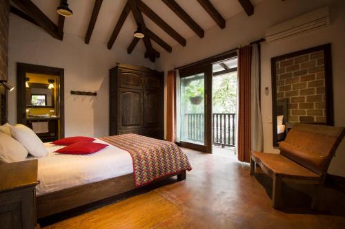 En eller flere senge i et værelse på Casa Del Reloj