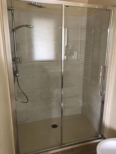 a shower with a glass door in a bathroom at Villa Lò in Chieti