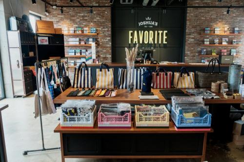 a counter in a store with bags on it at Playce Camp Jeju in Seogwipo