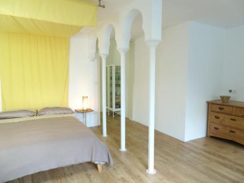 a bedroom with a large bed and a wooden floor at Downstairs6b in Dipperz
