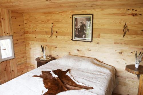 Llit o llits en una habitació de Le Domaine De La Genette