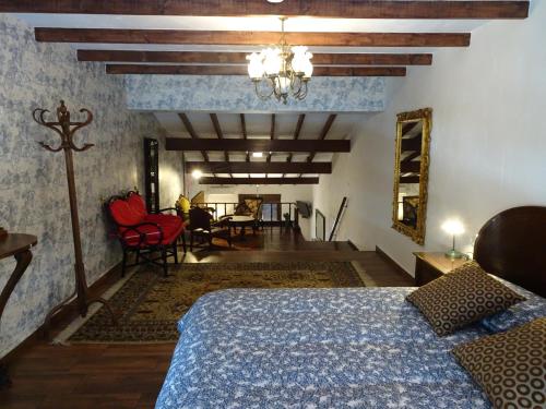 a bedroom with a bed and a dining room at Mi Naranjo (heated pool) in Orihuela Costa